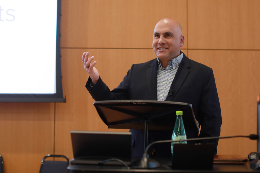 Anand Rao debates a point. 