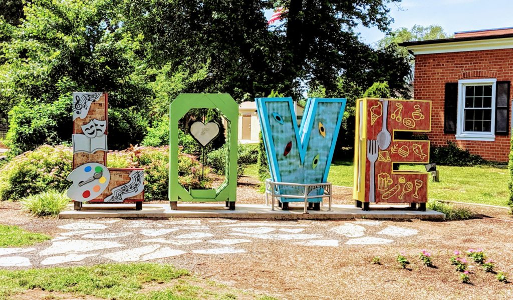A statue at Hurkamp Park in Fredericksburg, VA tha tsays "LOVE".