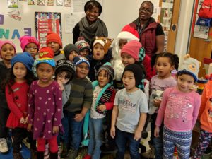Students in the Virginia PreSchool Initiative program wearing new hats from the Gift Box Drive