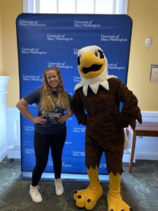Student posing with Sammy D Eagle