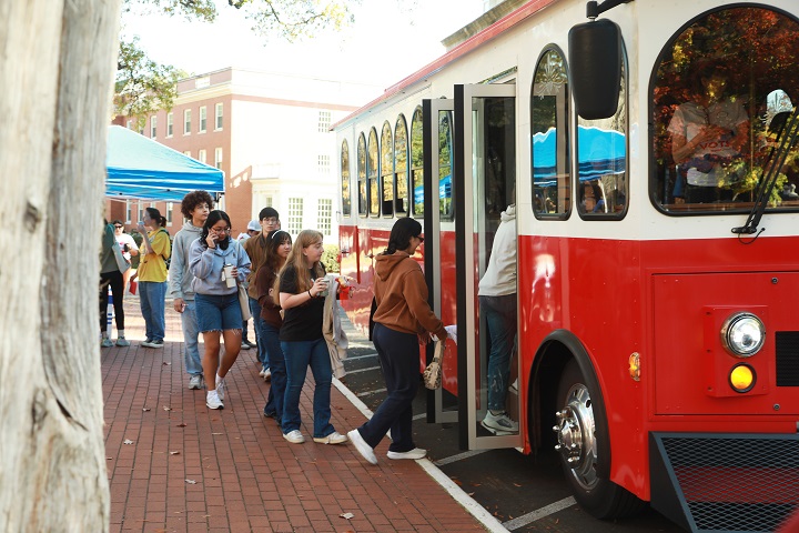 Students boarding a trolley. 