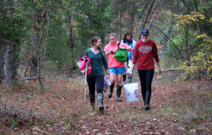 Dr. Melanie Szulczewski, Associate Professor, Earth and Environmental Sciences leads UMW students, Taylor McConnell (Wearing Pink sweatshirt), Maura Slocum (wearing green shirt), and Meghan King (wearing red sweatshirt) in collecting soil, water and plant samples along Contrary Creek in Louisa County, Monday Oct. 26, 2015. Dr. Szulczewski is doing a long term study of the creek and surrounding soils as a result of pollution due to pyrite mining activity in the area. (Photo by Norm Shafer).