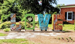 A statue at Hurkamp Park in Fredericksburg, VA that says "LOVE".