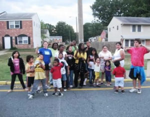a group of students standing in a parking lot