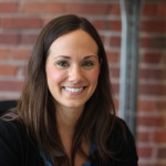 Headshot of a former student smiling. Image can be clicked to visit the "Alumni Intros" page.