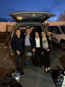 students in back of van