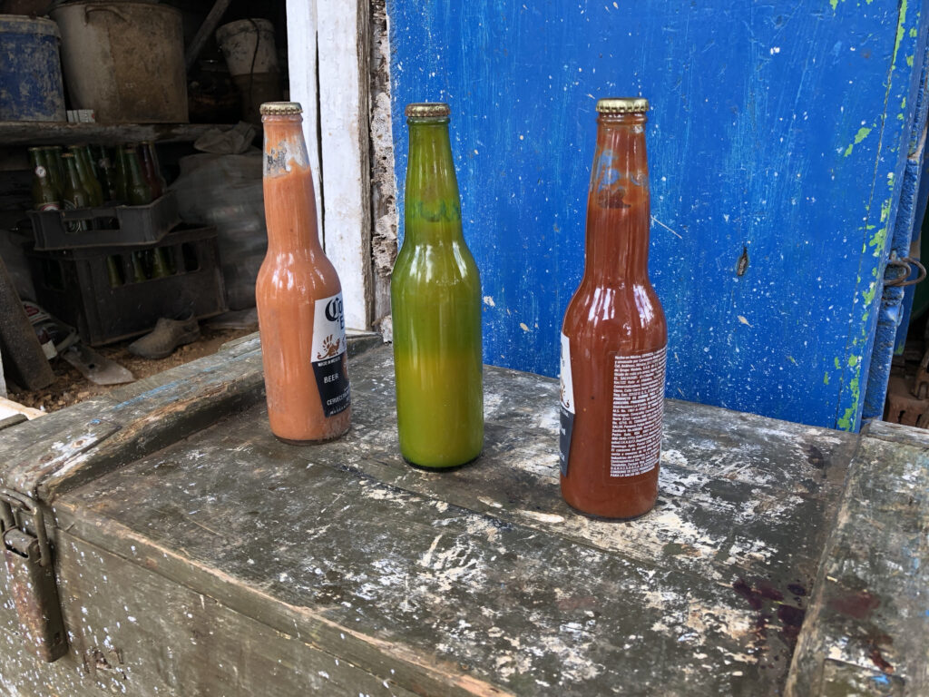 Example of three reused glass bottles at La Picadora.