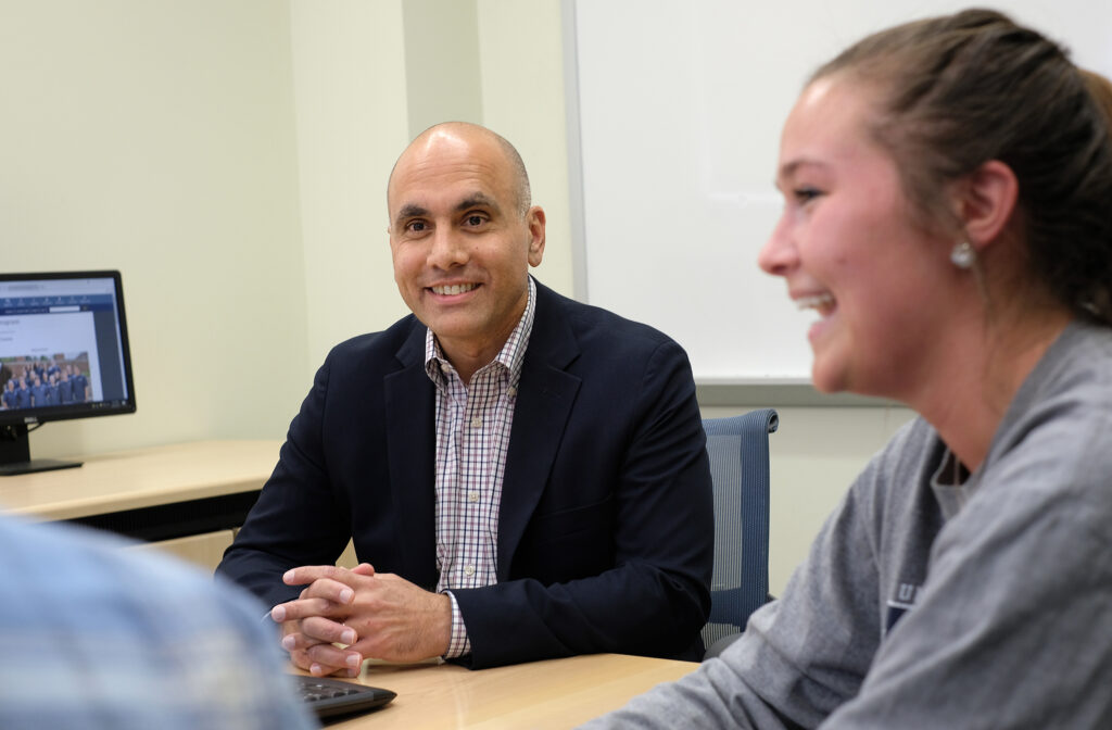 UMW Professor of Communication Anand Rao working with students.